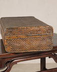 Woven rattan suitcase trunk, side view