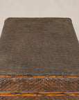 Close-up of woven rattan trunk lid and rounded corner
