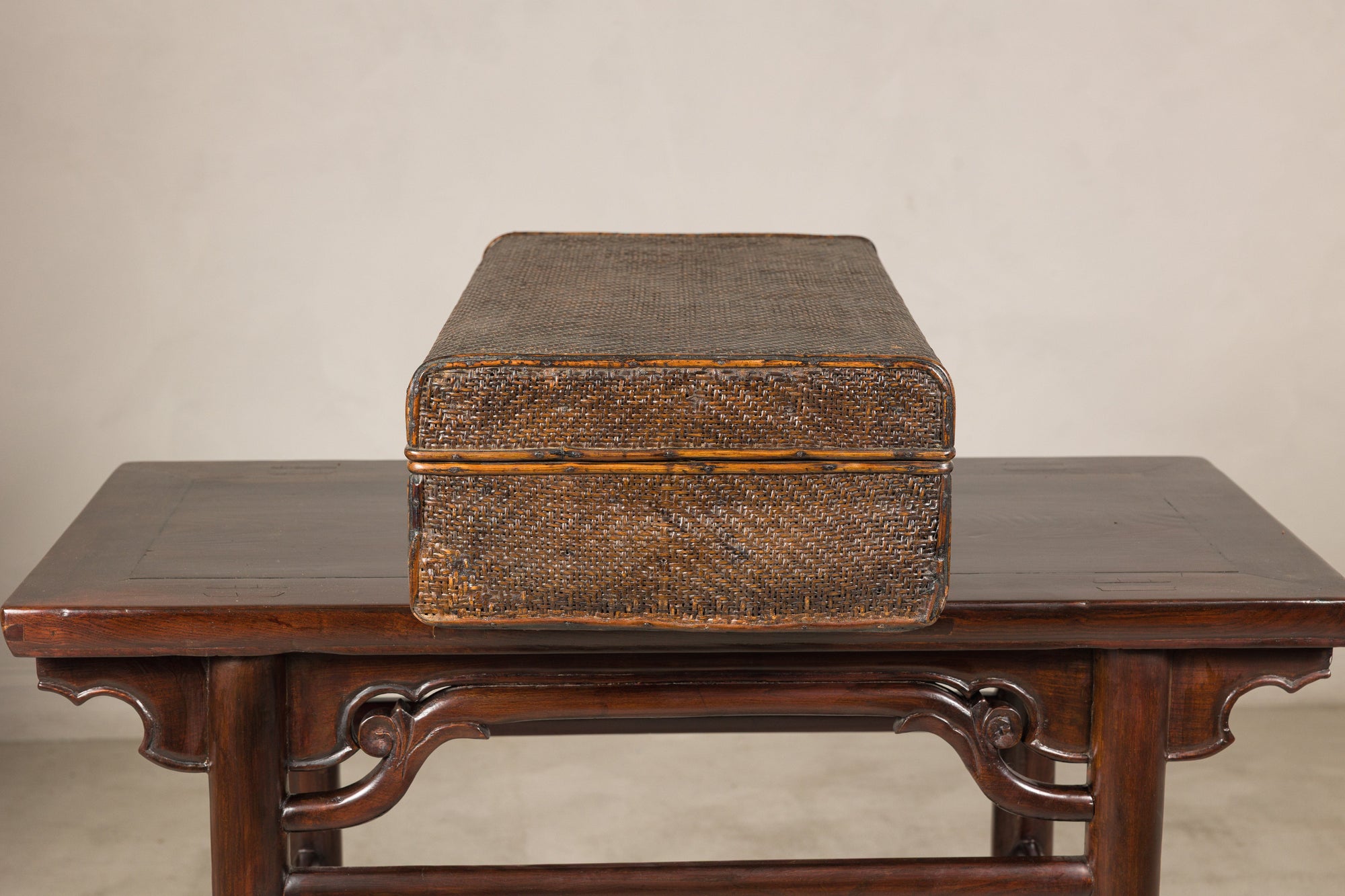 Woven rattan suitcase trunk, end view