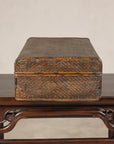 Woven rattan suitcase trunk, end view