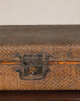 Close-up of woven rattan trunk handle, lock and latches