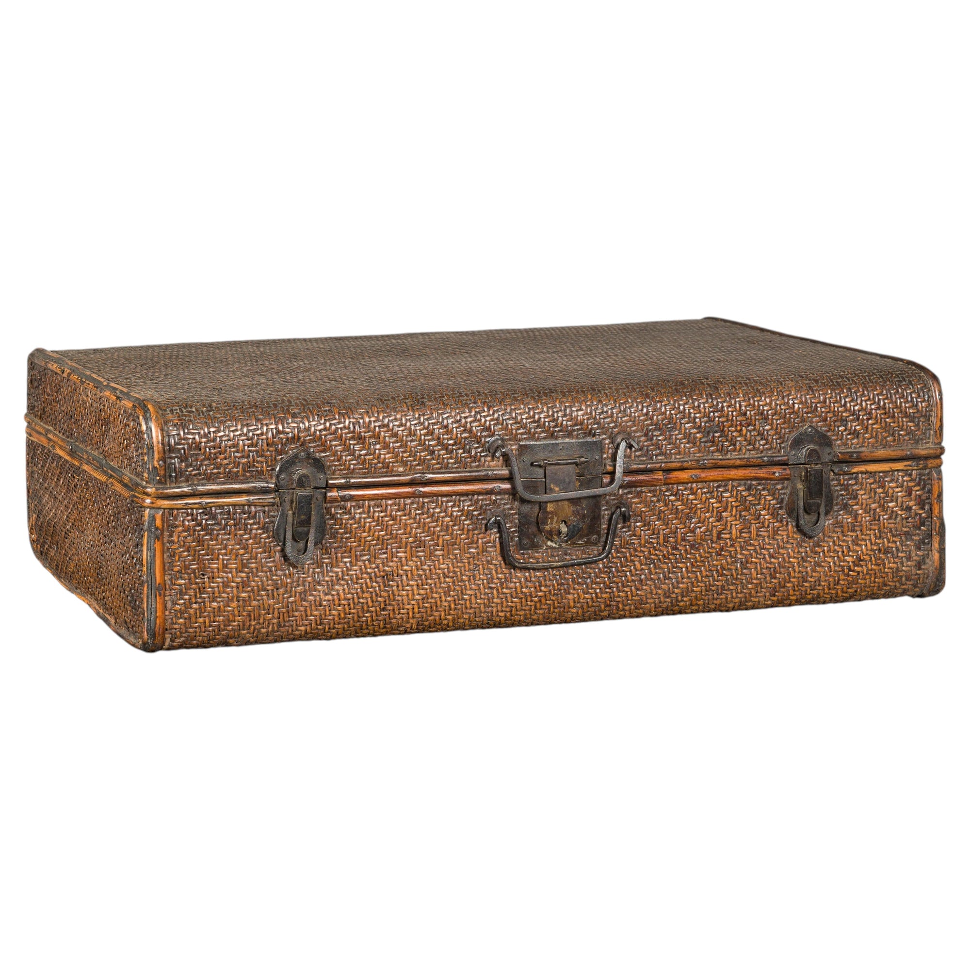 Brown woven rattan suitcase trunk with iron hardware from Late Qing Dynasty, closed on a white background.