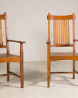 Pair of teak dining armchairs, straight-on front view