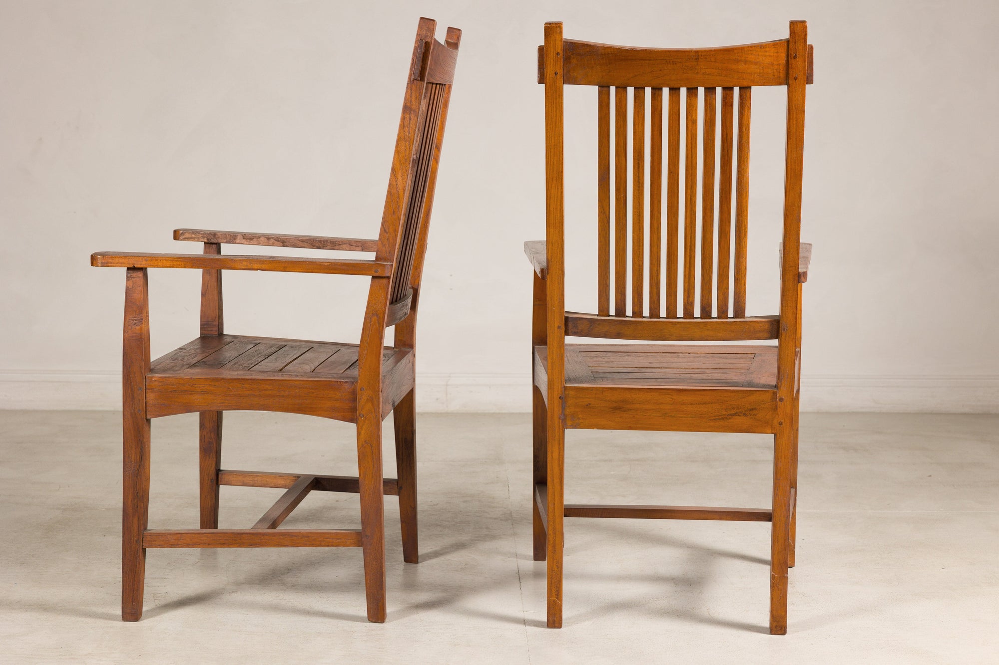 Pair of teak armchairs, side and rear view