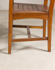 Close-up of teak chair lower legs and stretchers