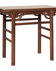 Brown Chinese elm console table, rectangular with four round legs and carved spandrels in Qing dynasty style.
