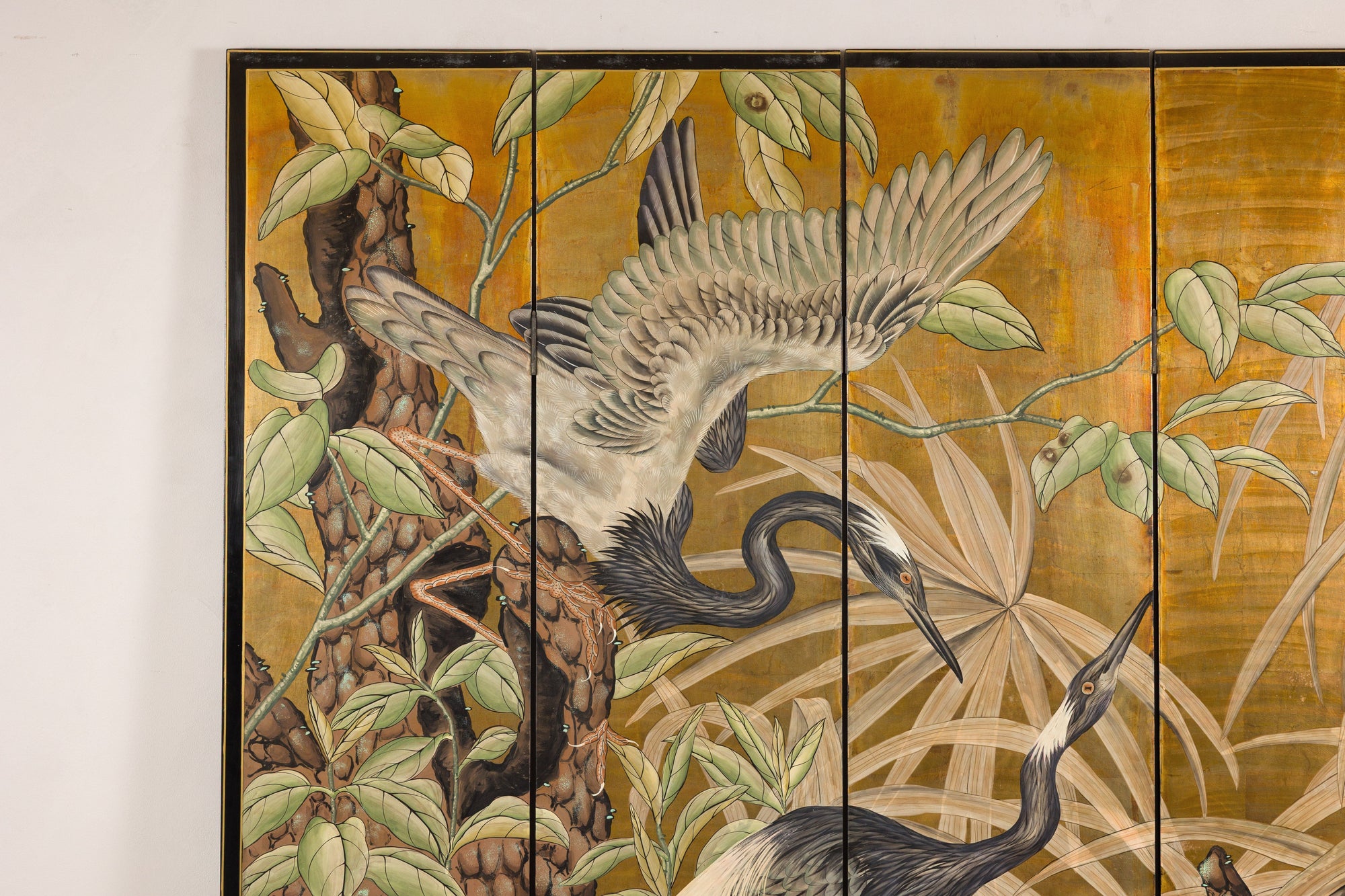 Close-up of crane and foliage on the painted screen