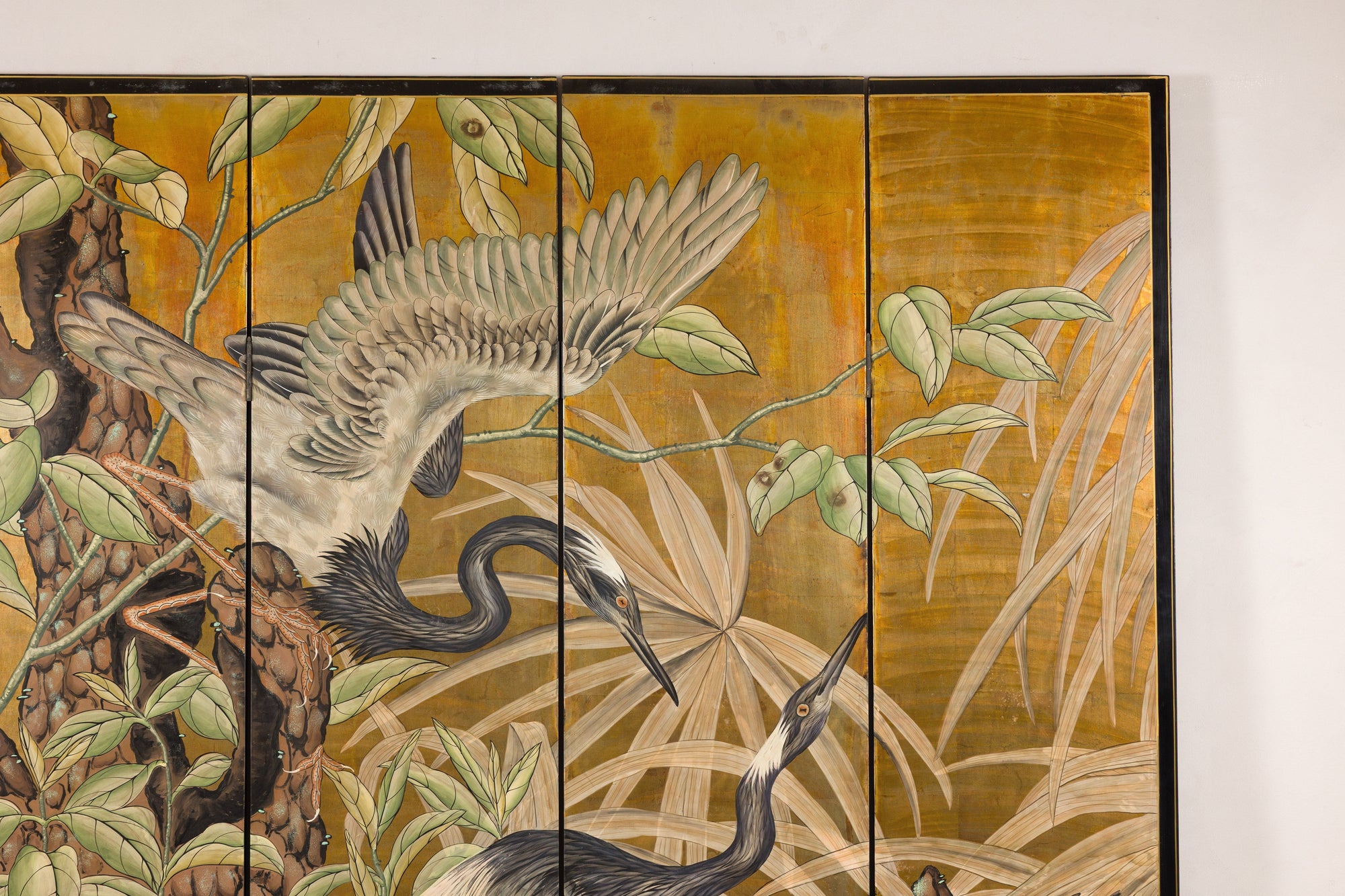 Close-up of upper painted panels with foliage on gold-tone ground