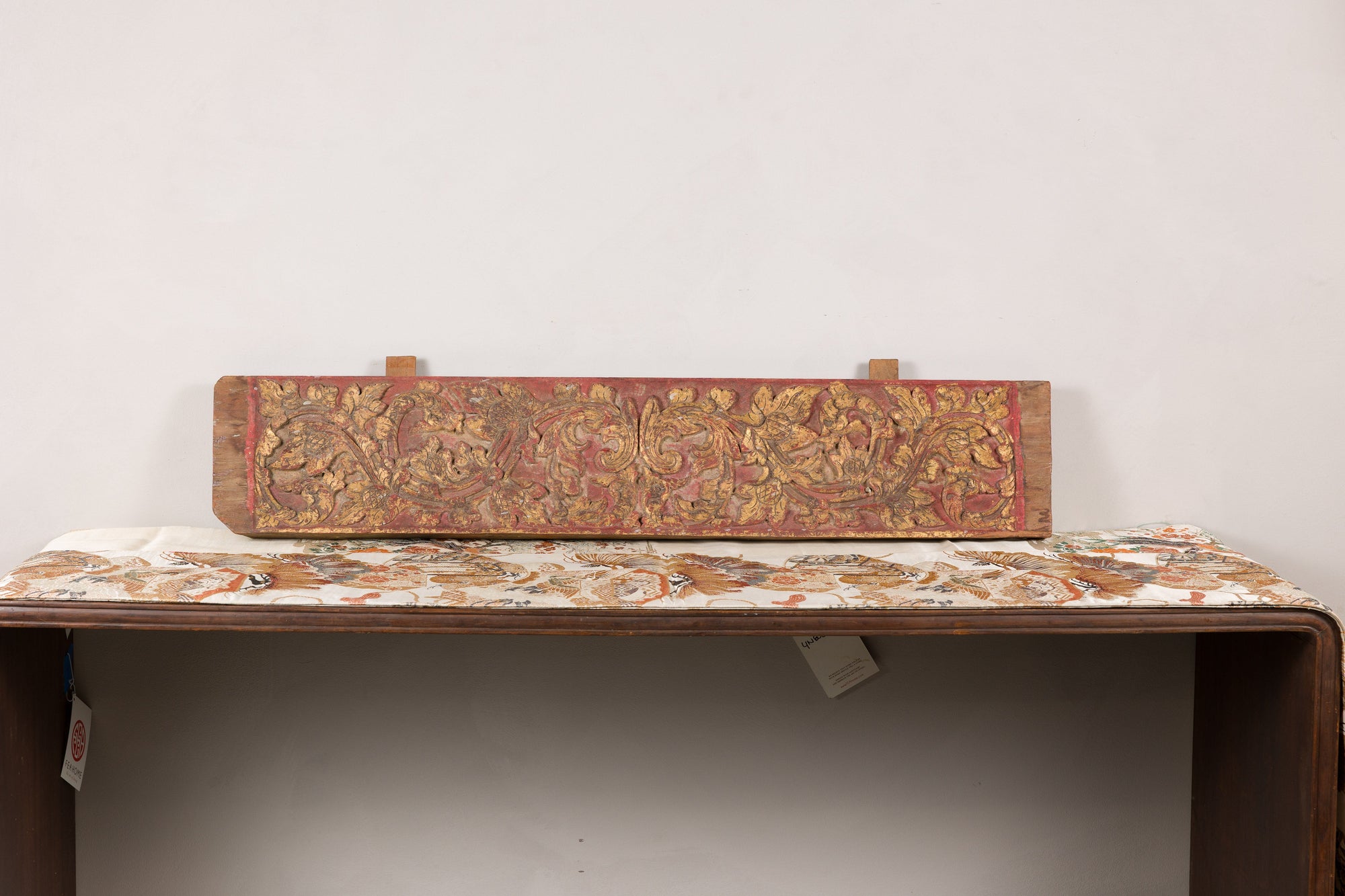 Gilt and red carved wood architectural panel front view