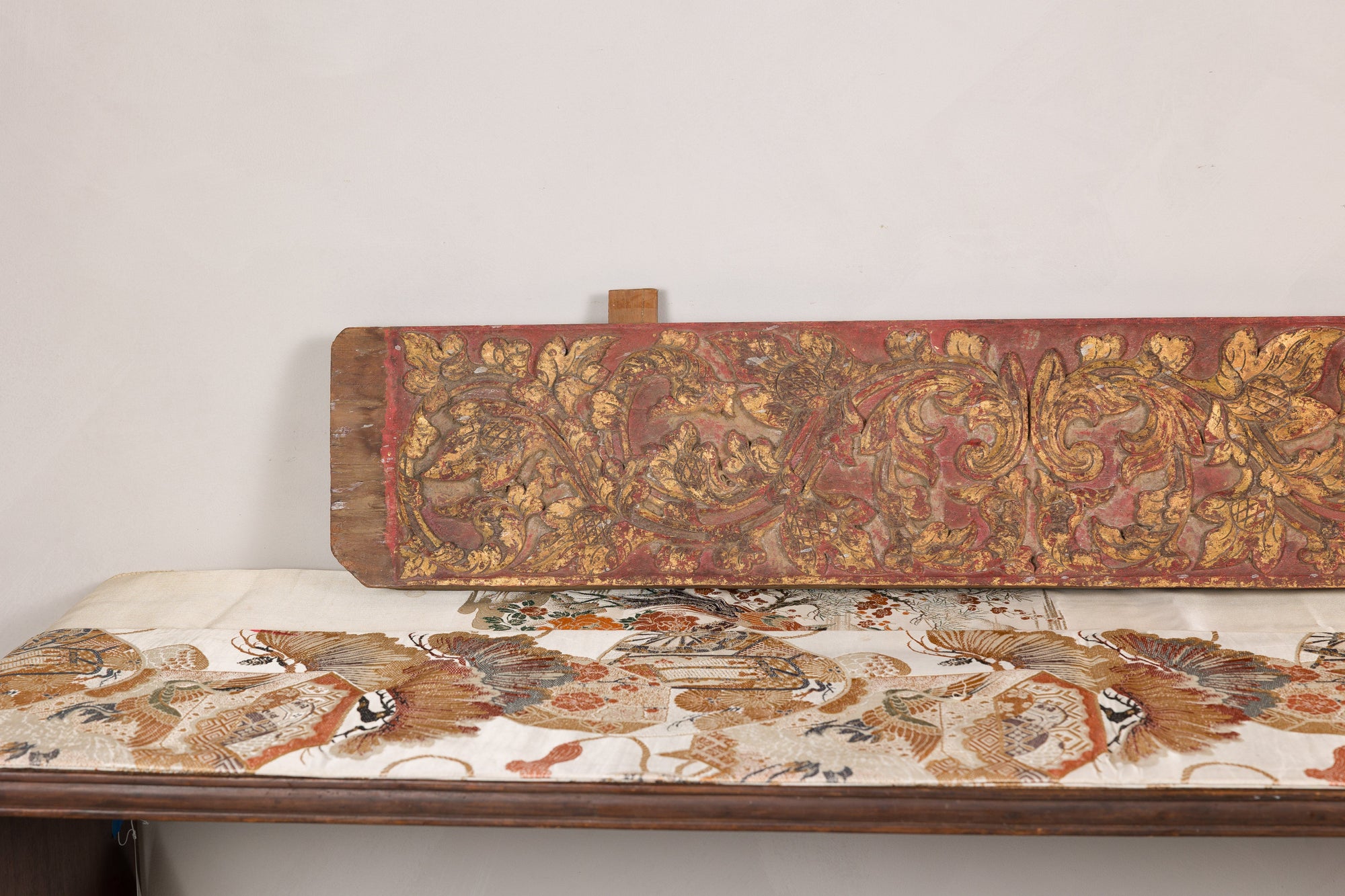 Gilt and red carved wood architectural panel side view