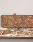 Gilt and red carved wood architectural panel side view