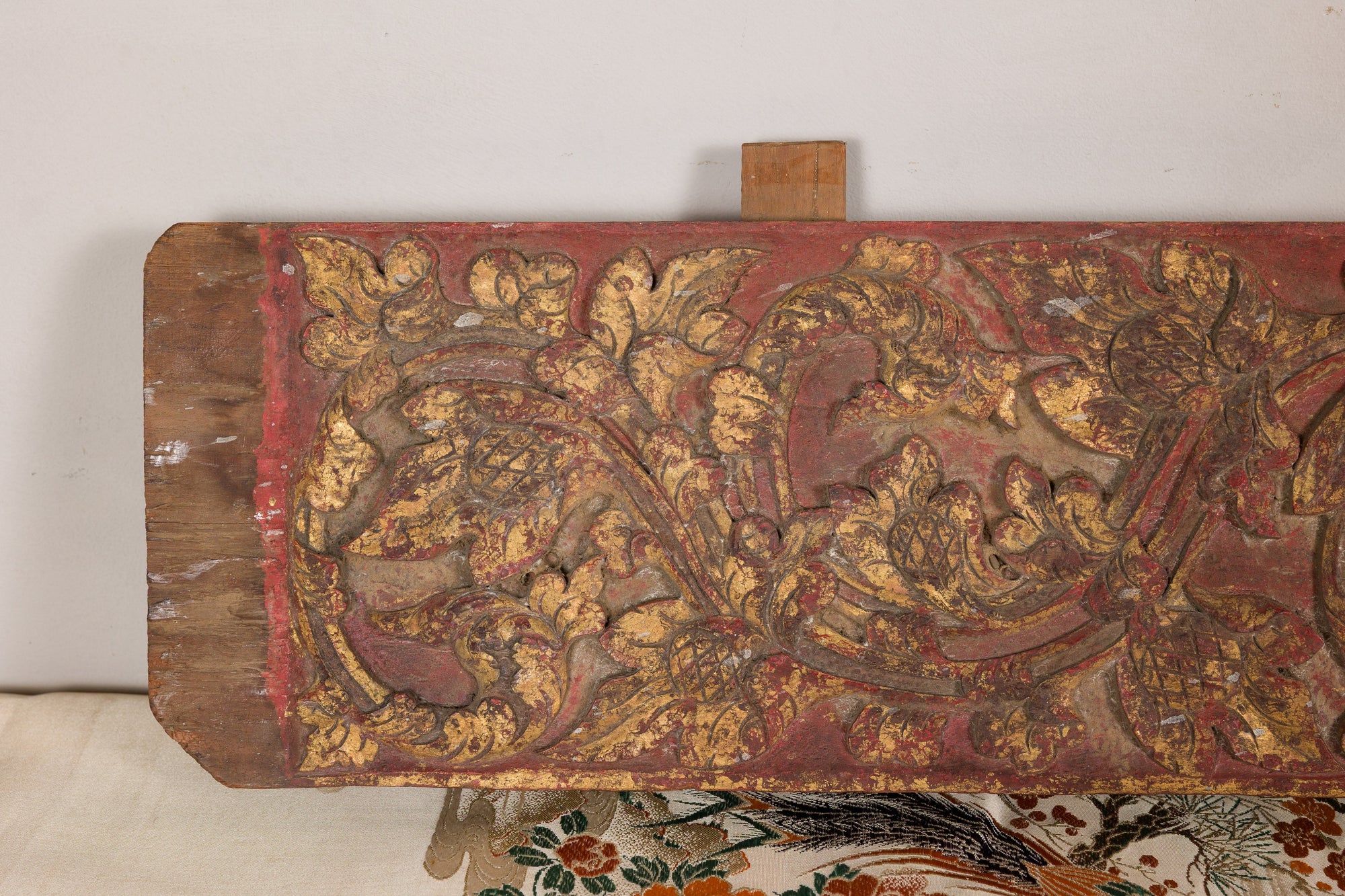 Gilt and red carved wood architectural panel back view