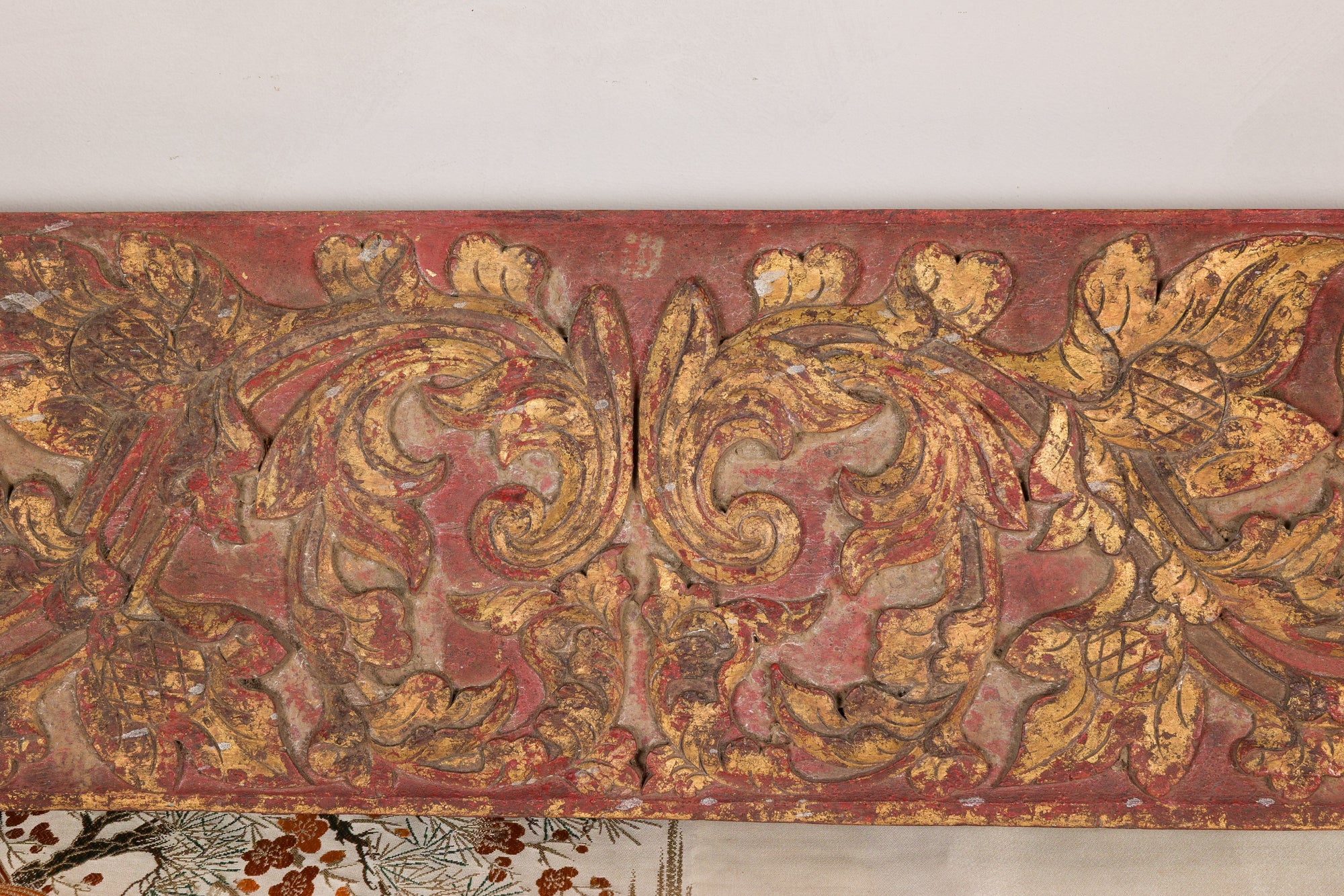 Gilt and red carved wood architectural panel top view