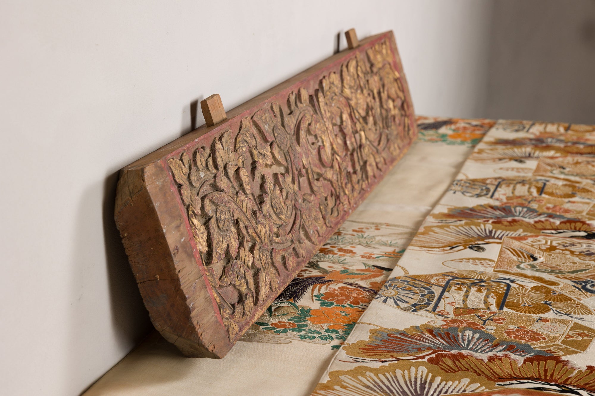 Gilt and red carved wood architectural panel construction detail