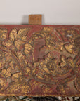 Gilt and red carved wood architectural panel close-up detail