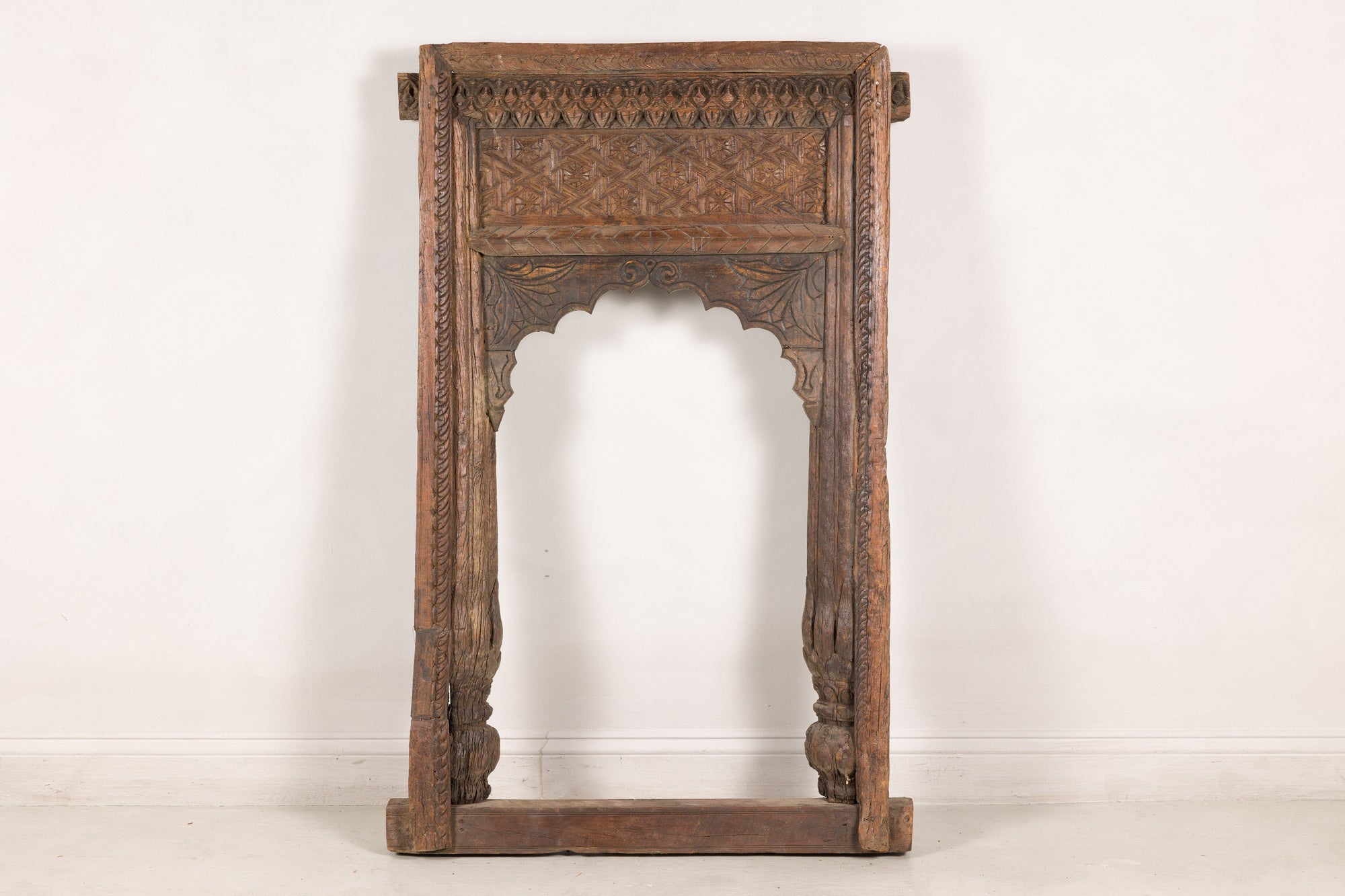 Antique Indian carved wood frame, straight-on front view