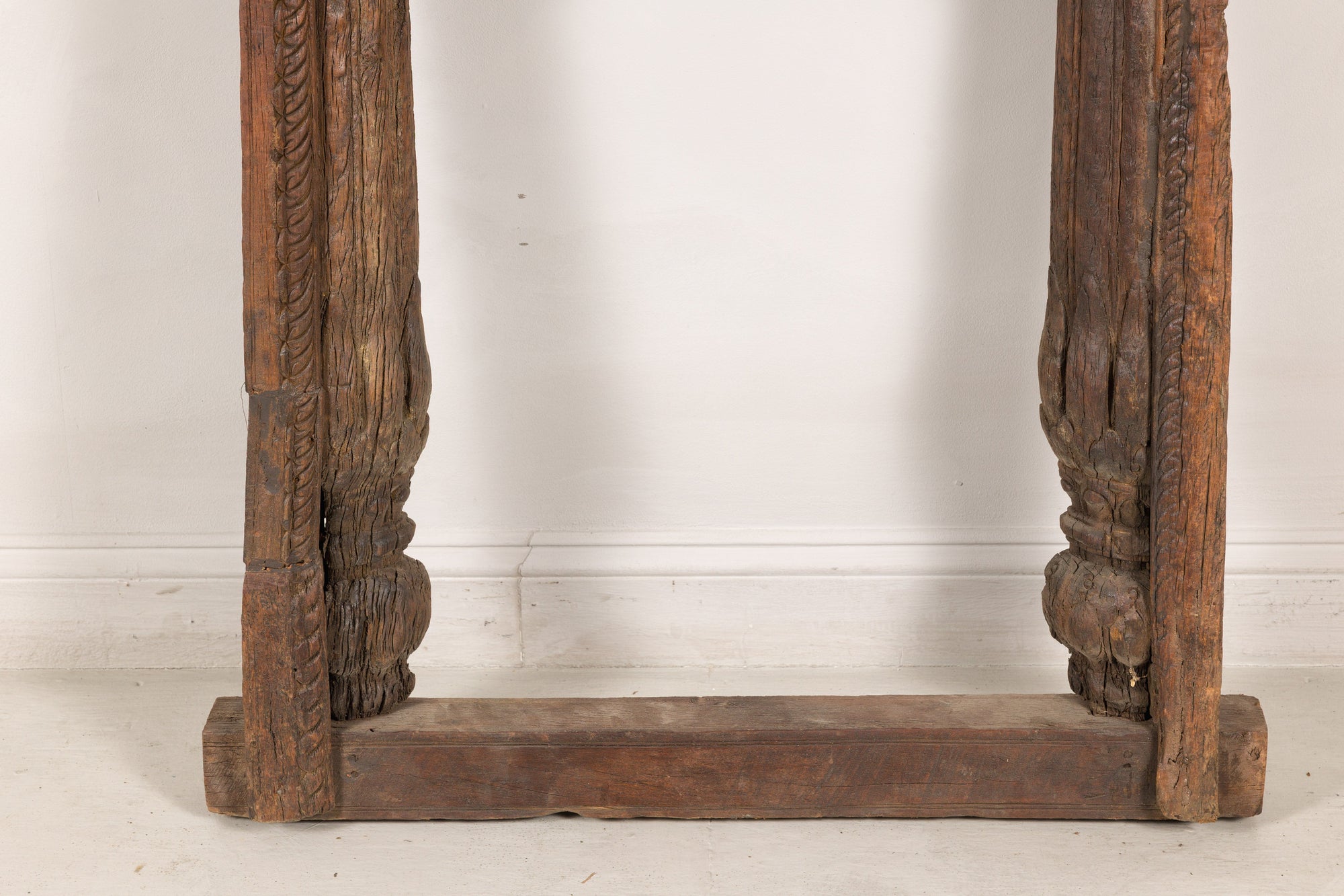 Close-up of lower carved frame and feet