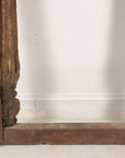 Close-up of lower carved frame and feet