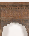 Close-up of upper carved panel and floral motifs
