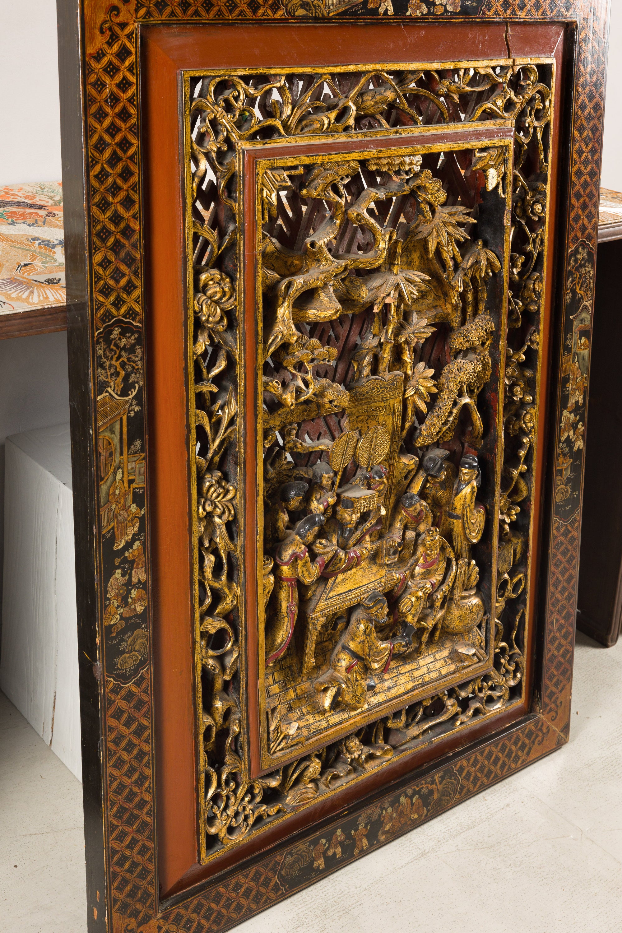 Carved giltwood wall panel, angled left view