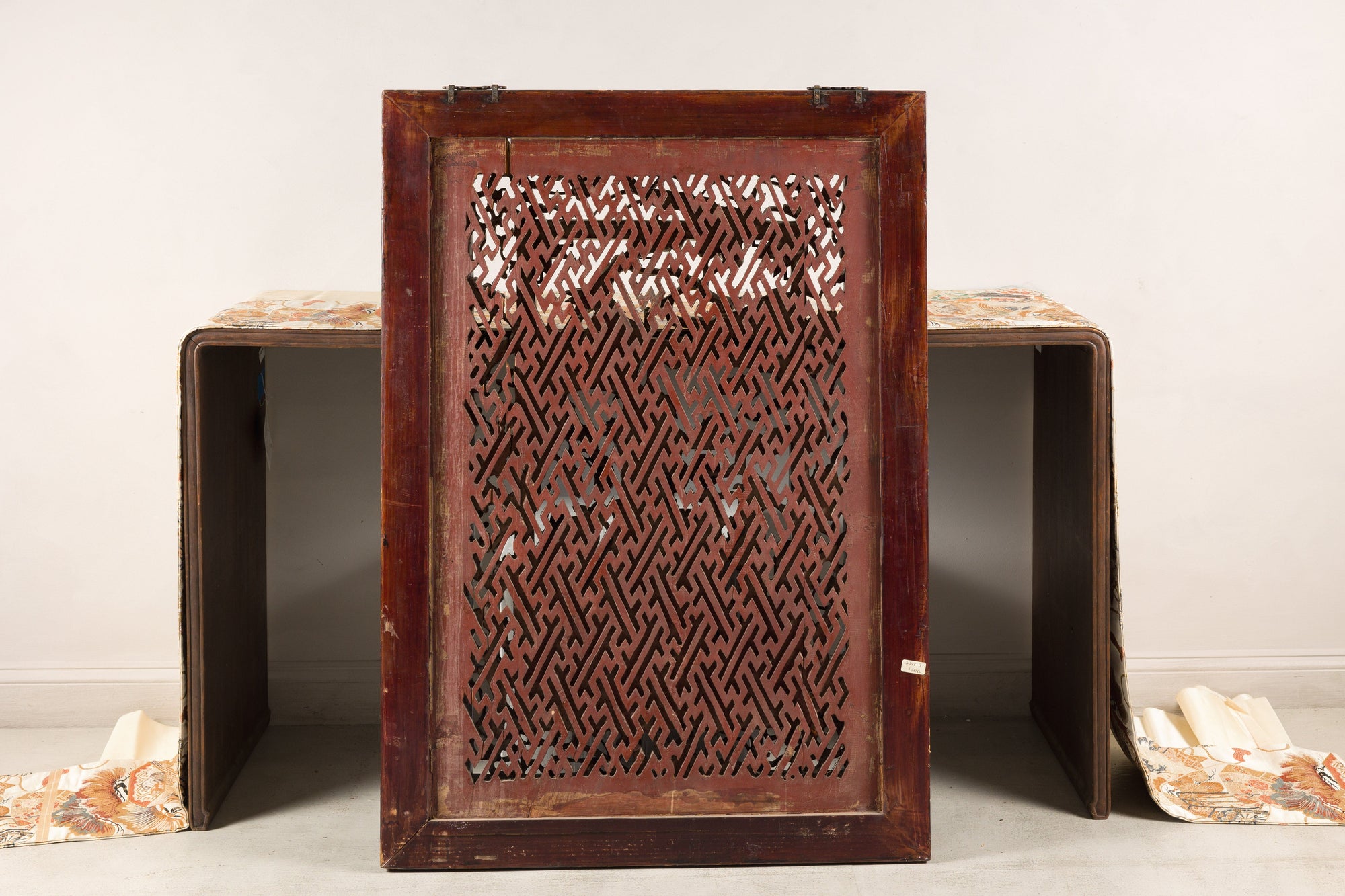Reverse of carved Chinese panel showing open latticework