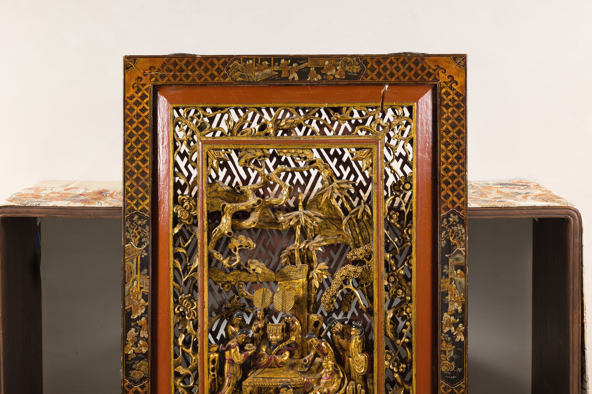 Close-up of upper half of the carved giltwood panel