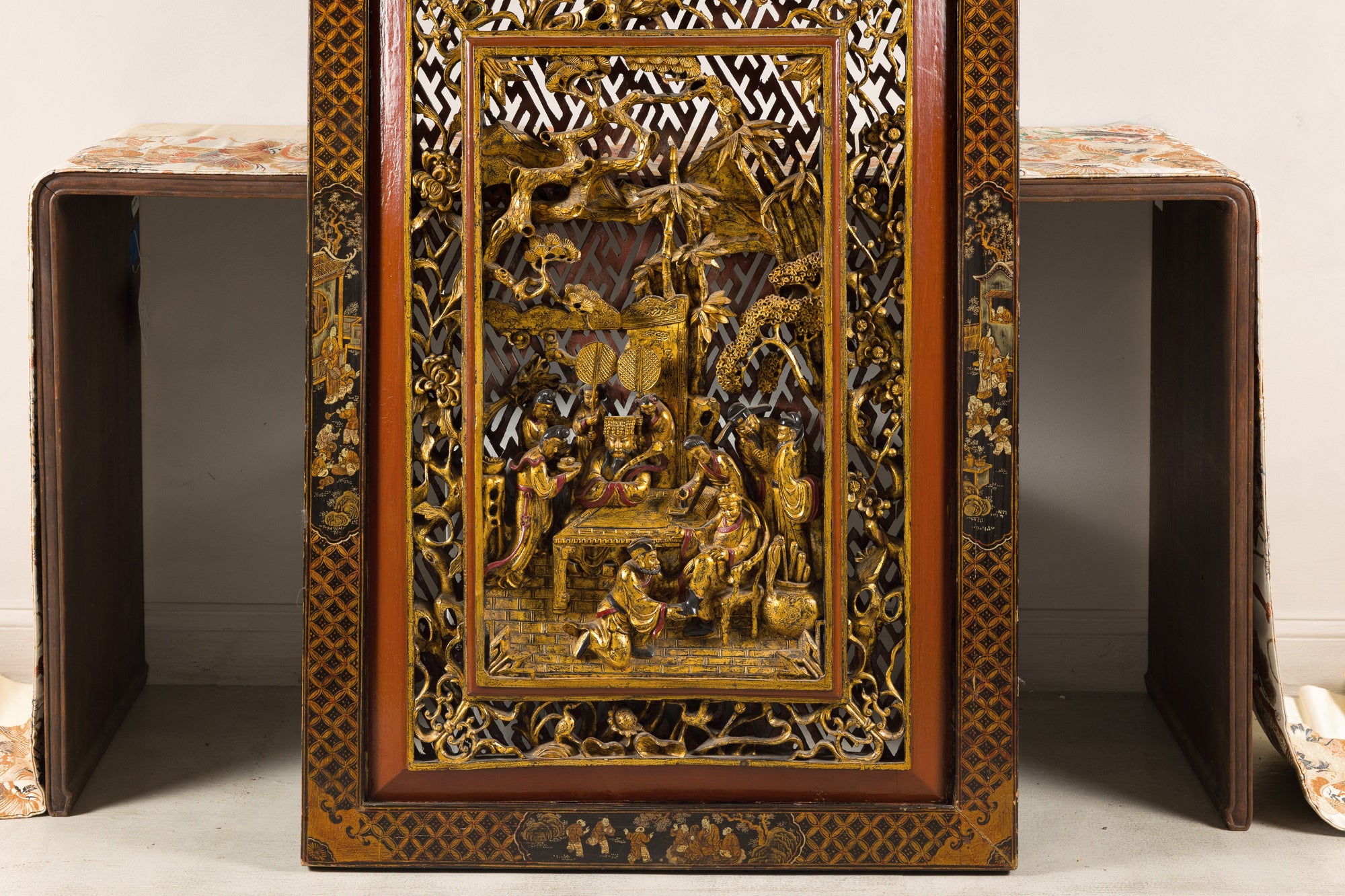 Full front view of carved wall panel and lower figures