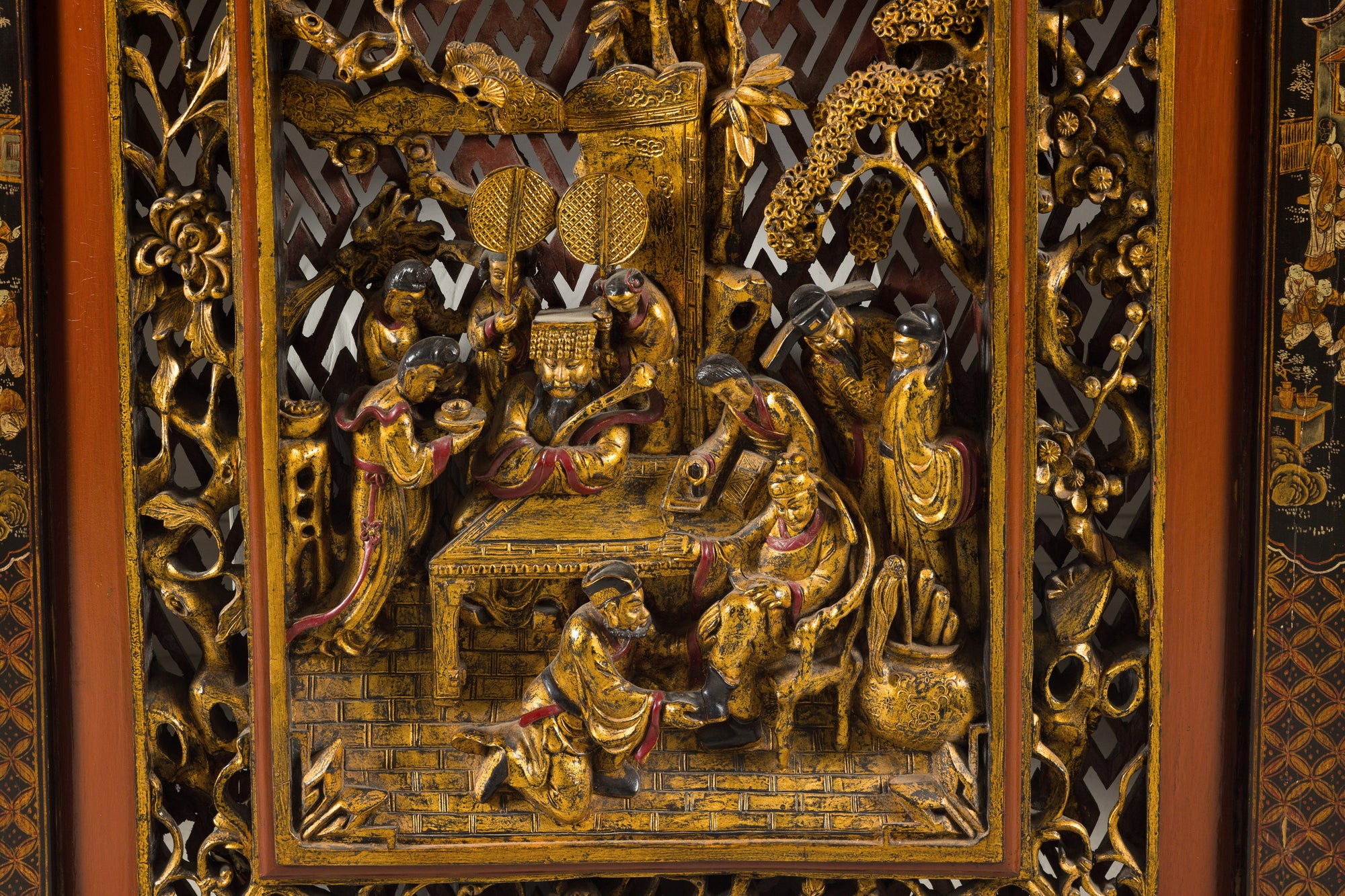 Close-up of central carved Chinese court scene