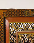 Close-up of upper corner border and carved latticework