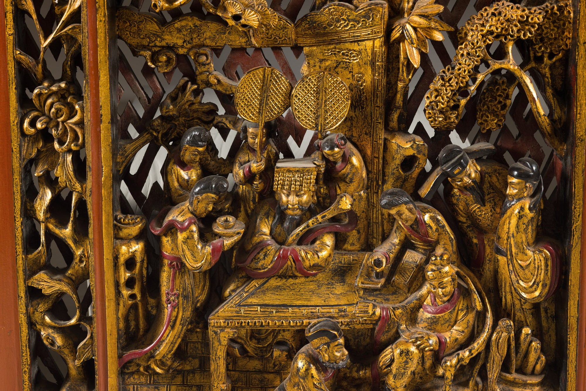 Close-up of carved figures in the lower panel