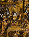 Close-up of carved figures in the lower panel