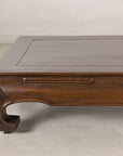 Close-up of a scroll foot, apron and tabletop corner