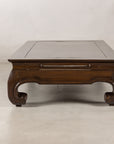 End view of the low Chinese coffee table and paired scroll feet