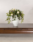 Low elm kang table styled with a white vase and flowers
