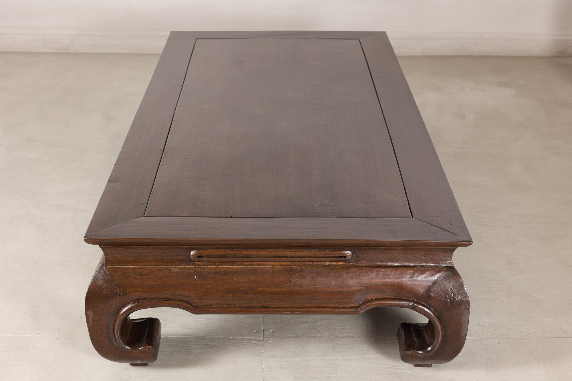 Elevated end view showing the recessed panel tabletop