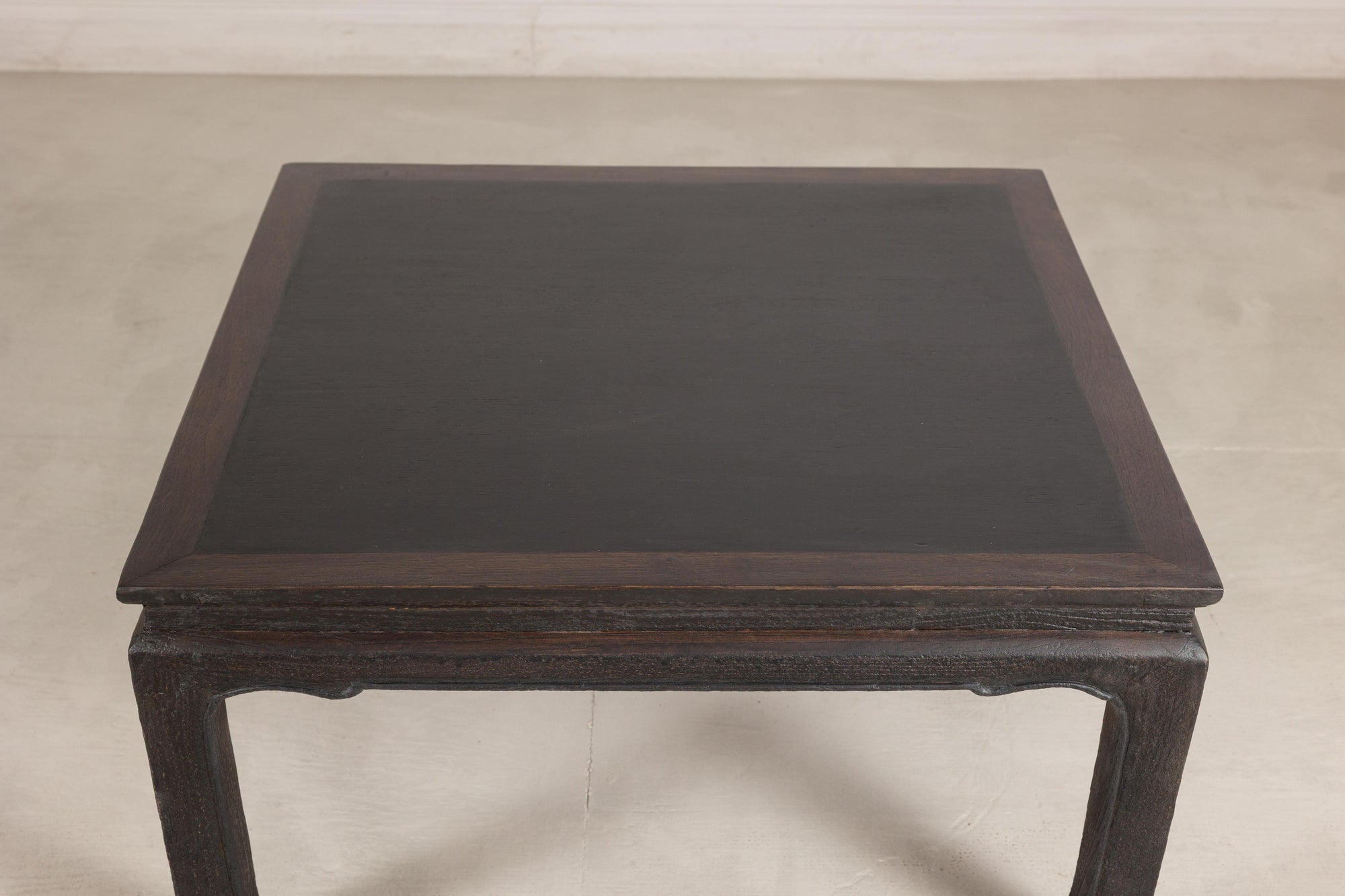 Chinese hardwood and dark stone coffee table base view