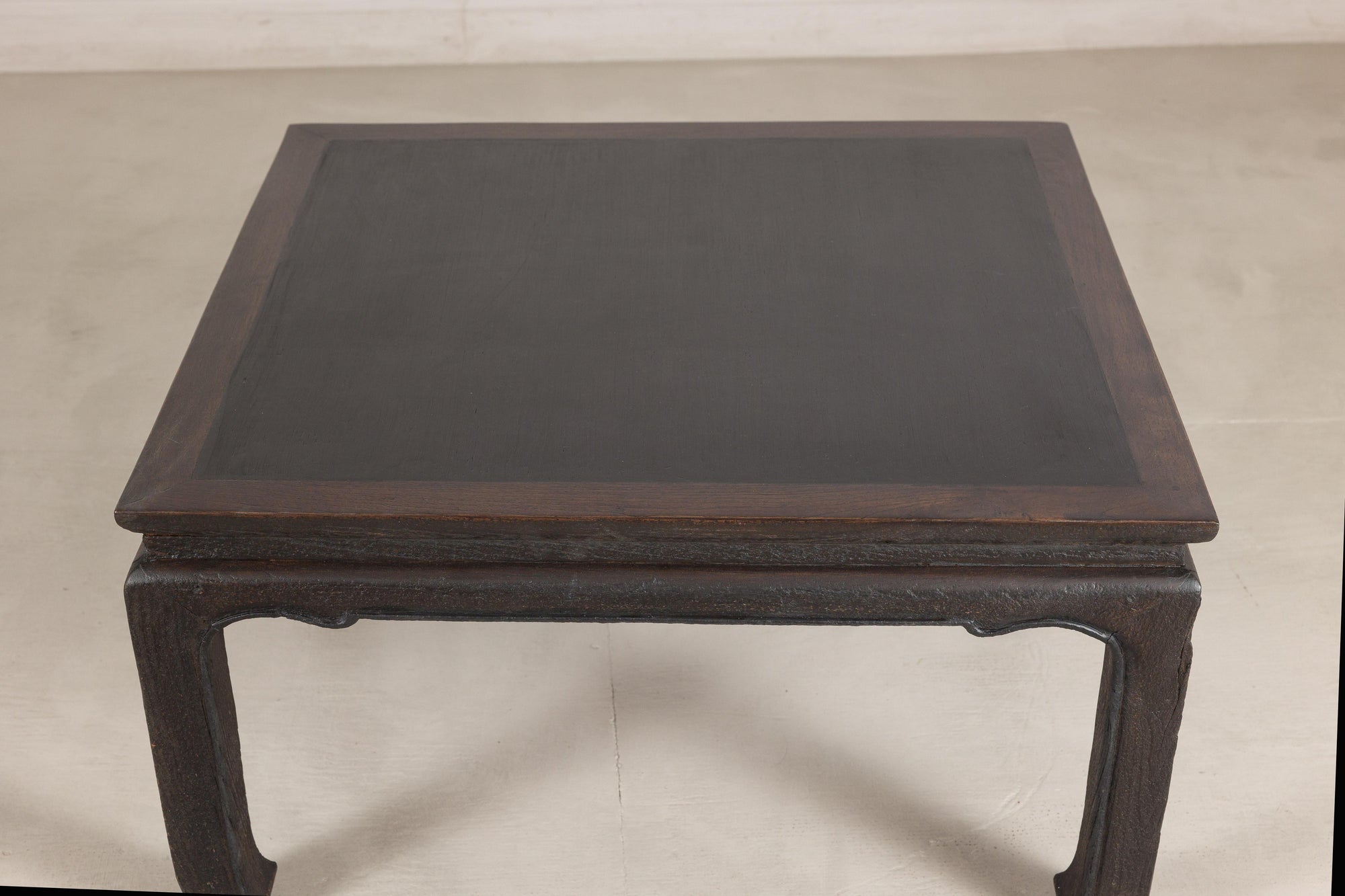 Chinese hardwood and dark stone coffee table profile view