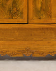 Close-up of the carved lower apron and elm wood grain