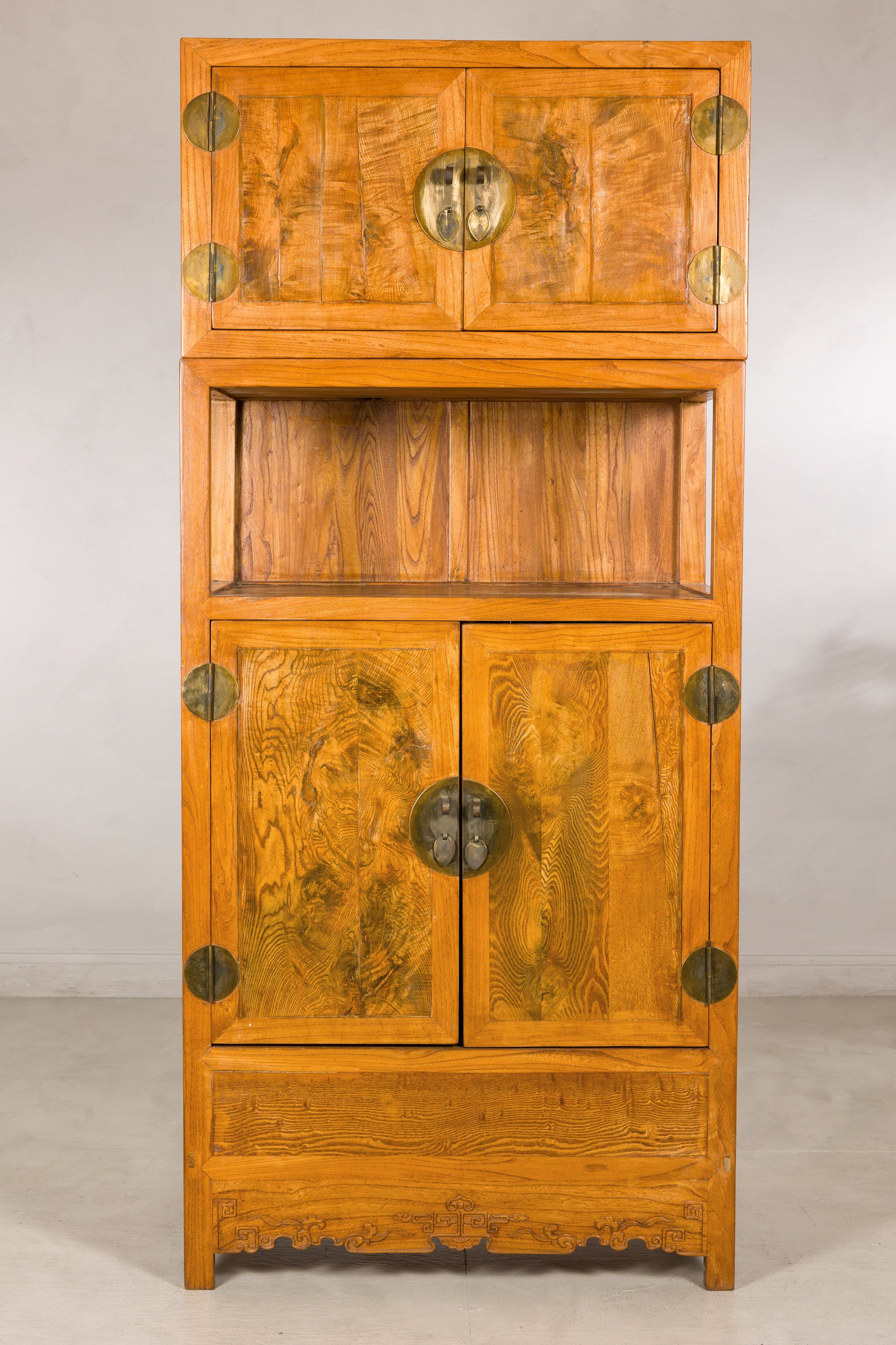 Front view of the tall Chinese cabinet with burlwood panels