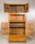 Tall Chinese cabinet with upper and lower doors open to interior shelves