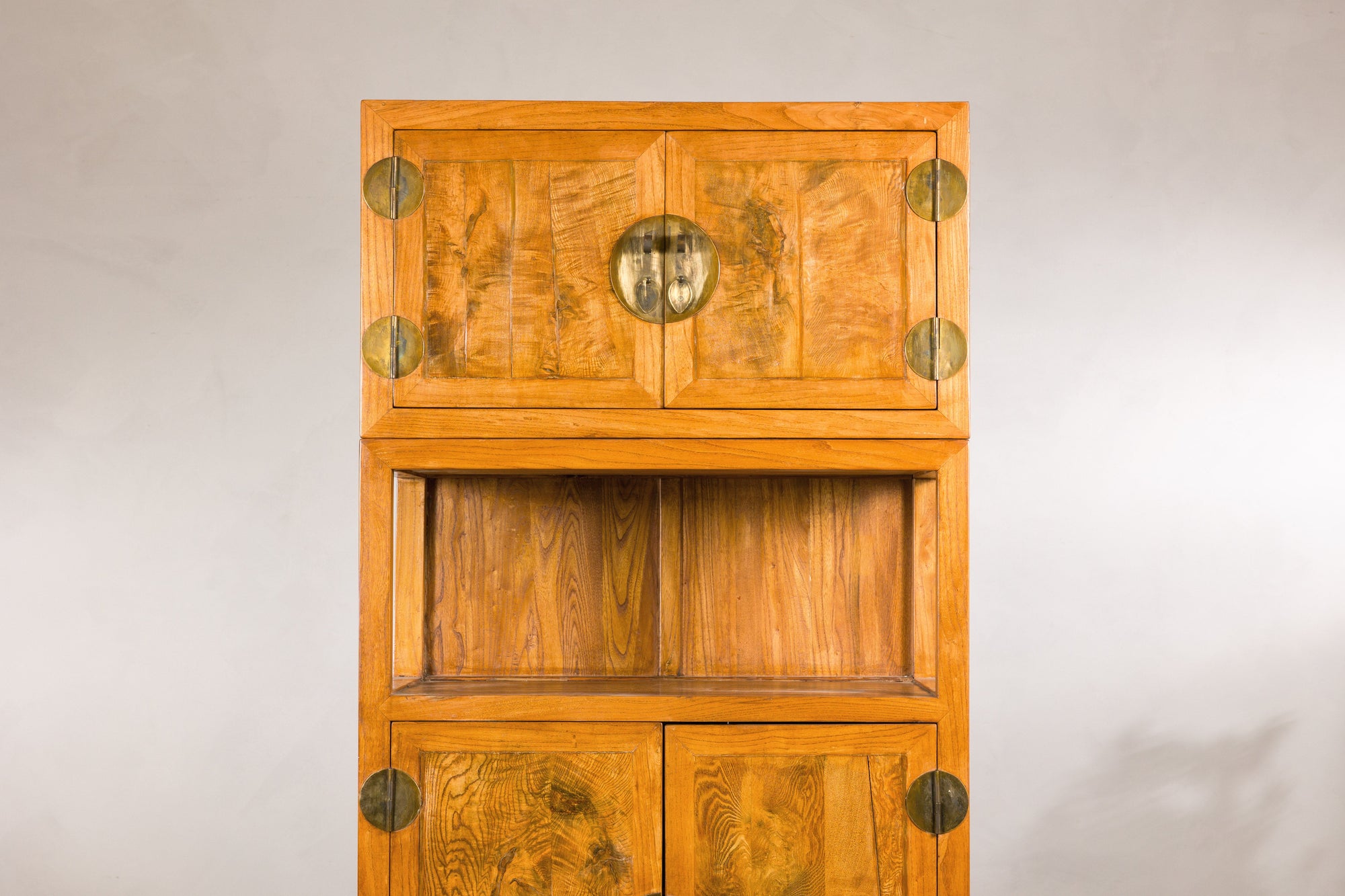 Upper cabinet and open shelf detail in warm elm wood