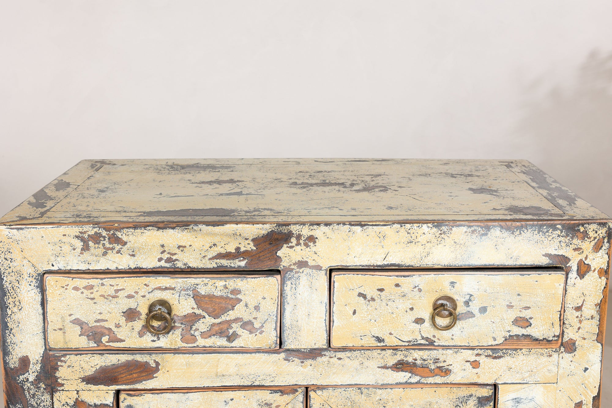 Close-up of the worn cabinet top and upper drawers