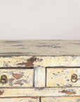 Close-up of the worn cabinet top and upper drawers