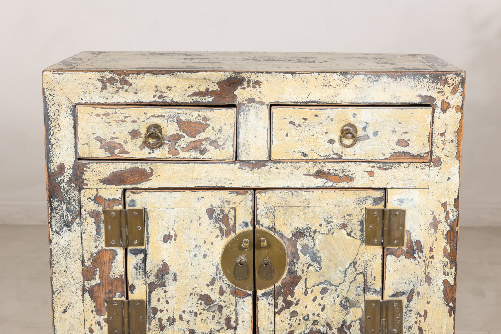 Close-up of two drawers and distressed cream lacquer