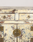 Close-up of two drawers and distressed cream lacquer