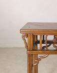 Close-up of a carved corner bracket and rounded tabletop edge