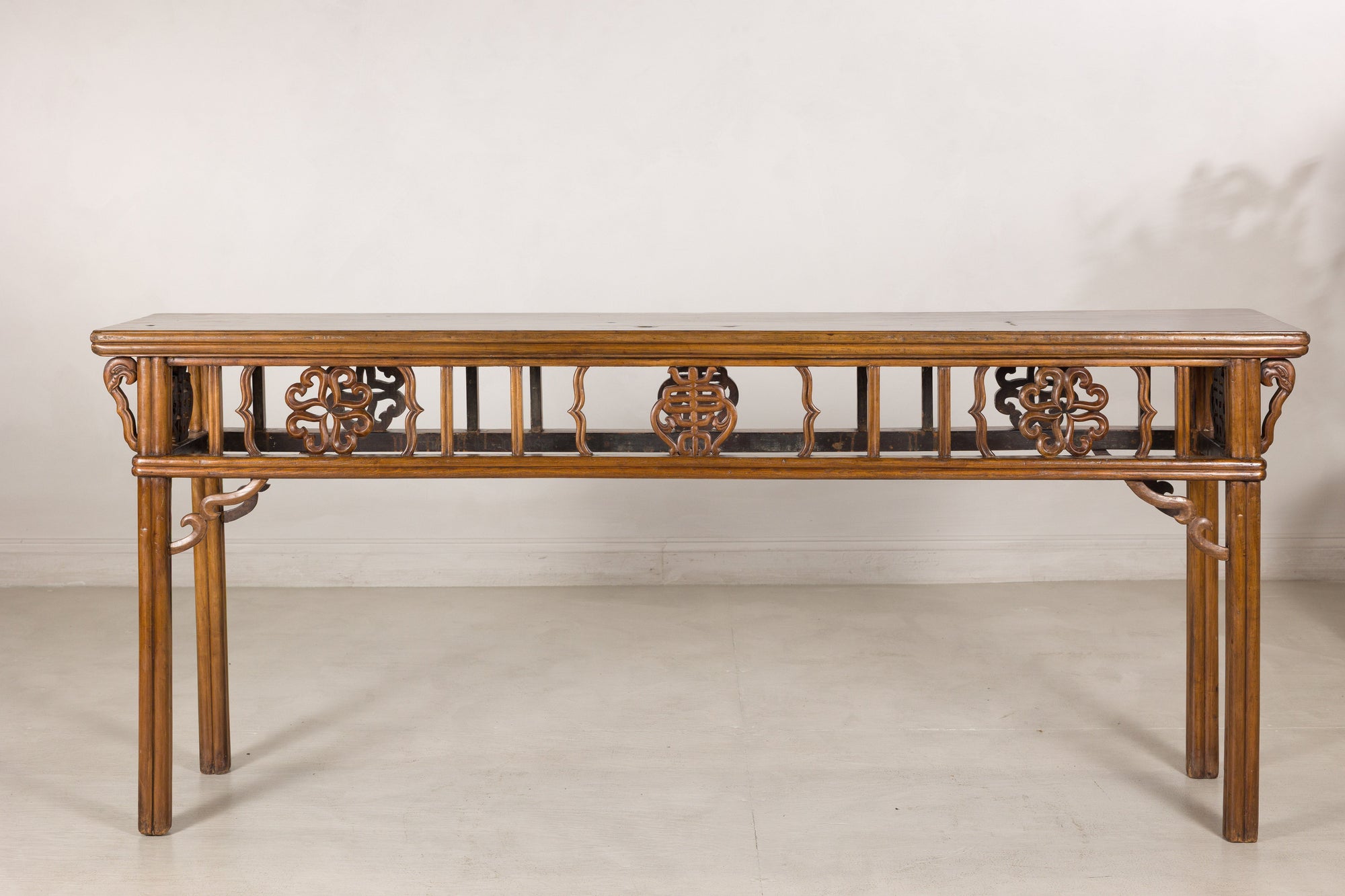 Front view of the long Chinese console table and pierced apron