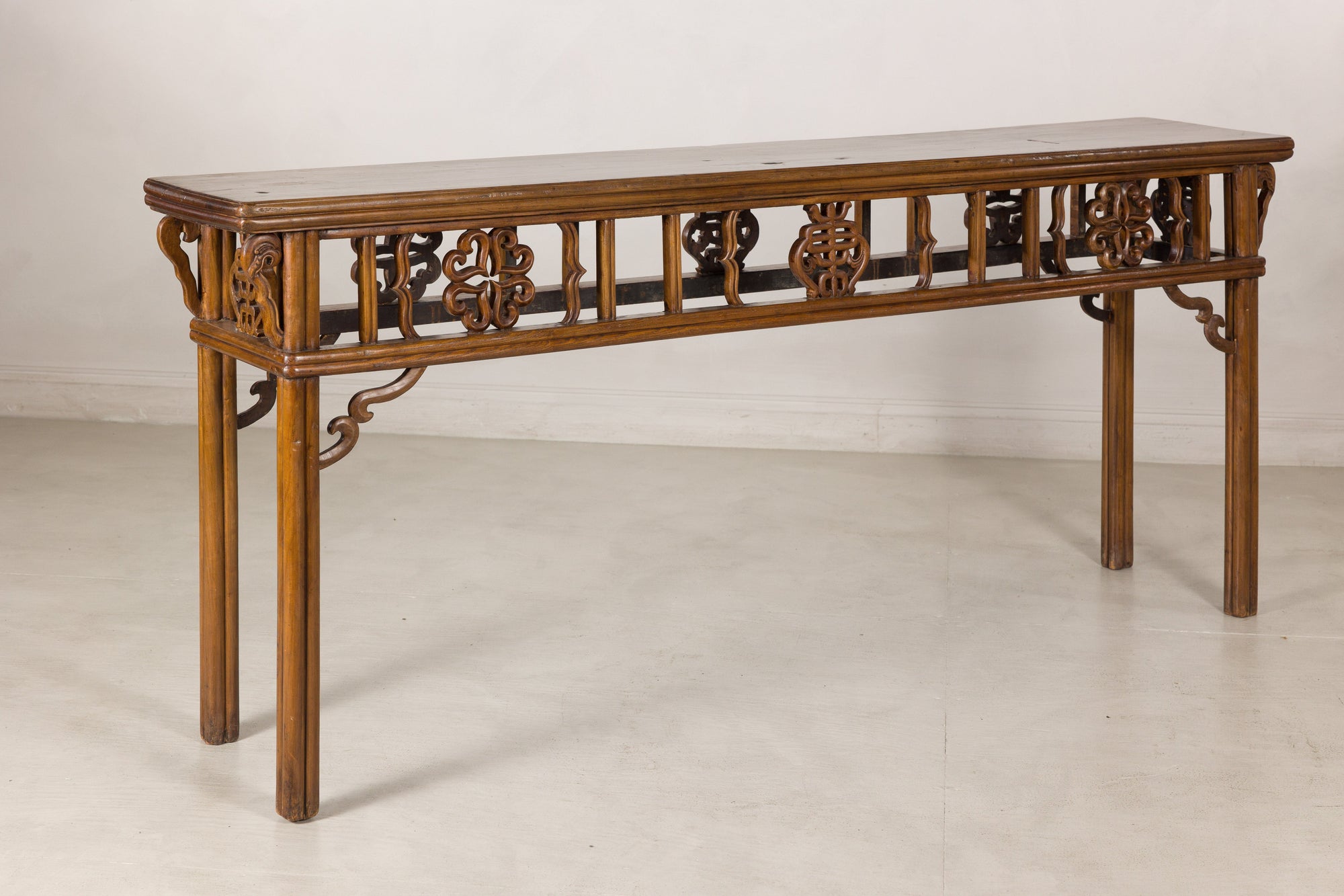 Left angled view of the long Chinese console table