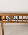 Close-up of the left side of the carved openwork apron and corner