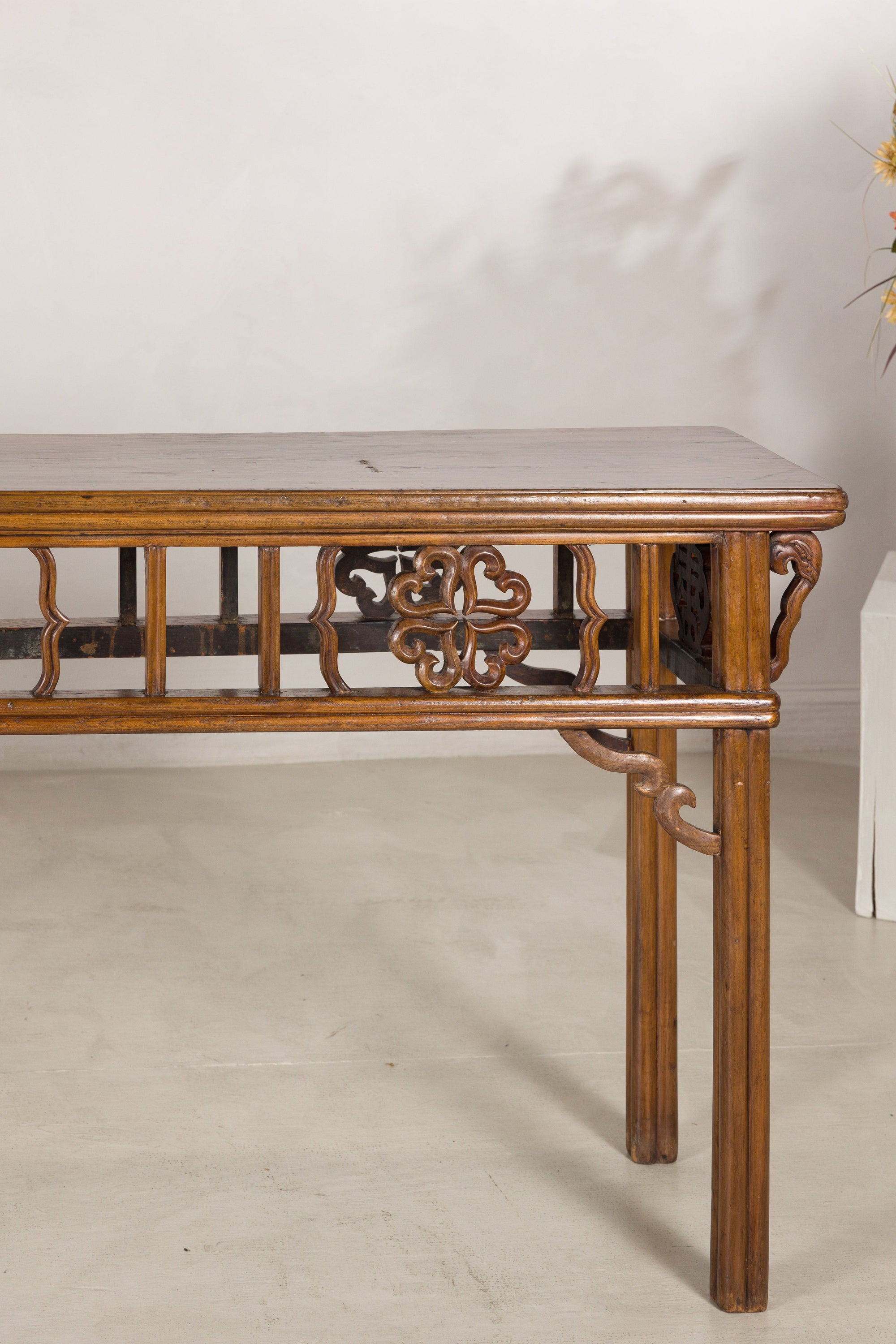Right end view of the console table with openwork apron detail